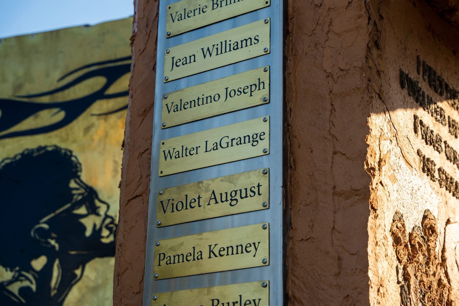 Brass name plaques on the memorial column